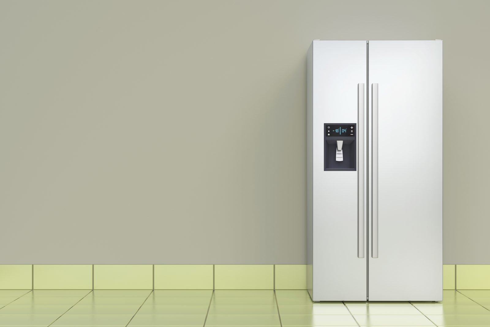 Built-in white refrigerator set flush into a run of modern fitted kitchen cabinetry